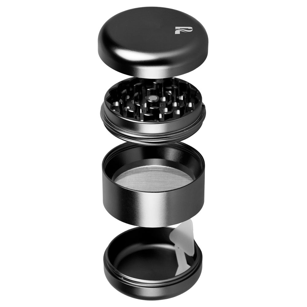 Black metal grinder with multiple compartments on a white background