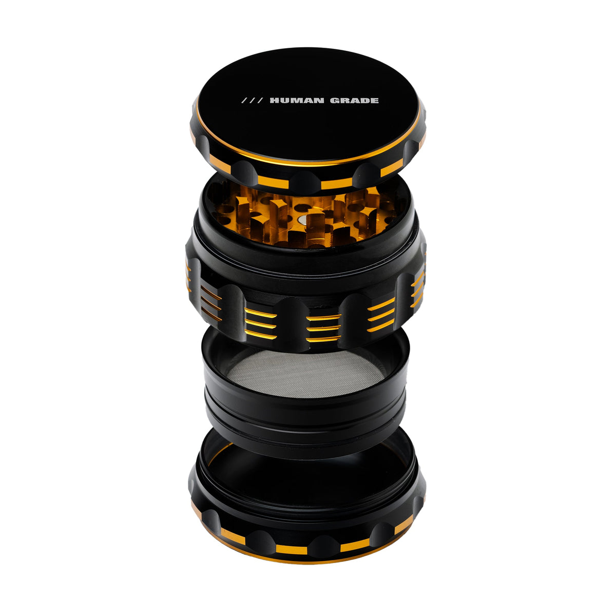 Black and orange herb grinder with 'Human Grade' branding on a white background