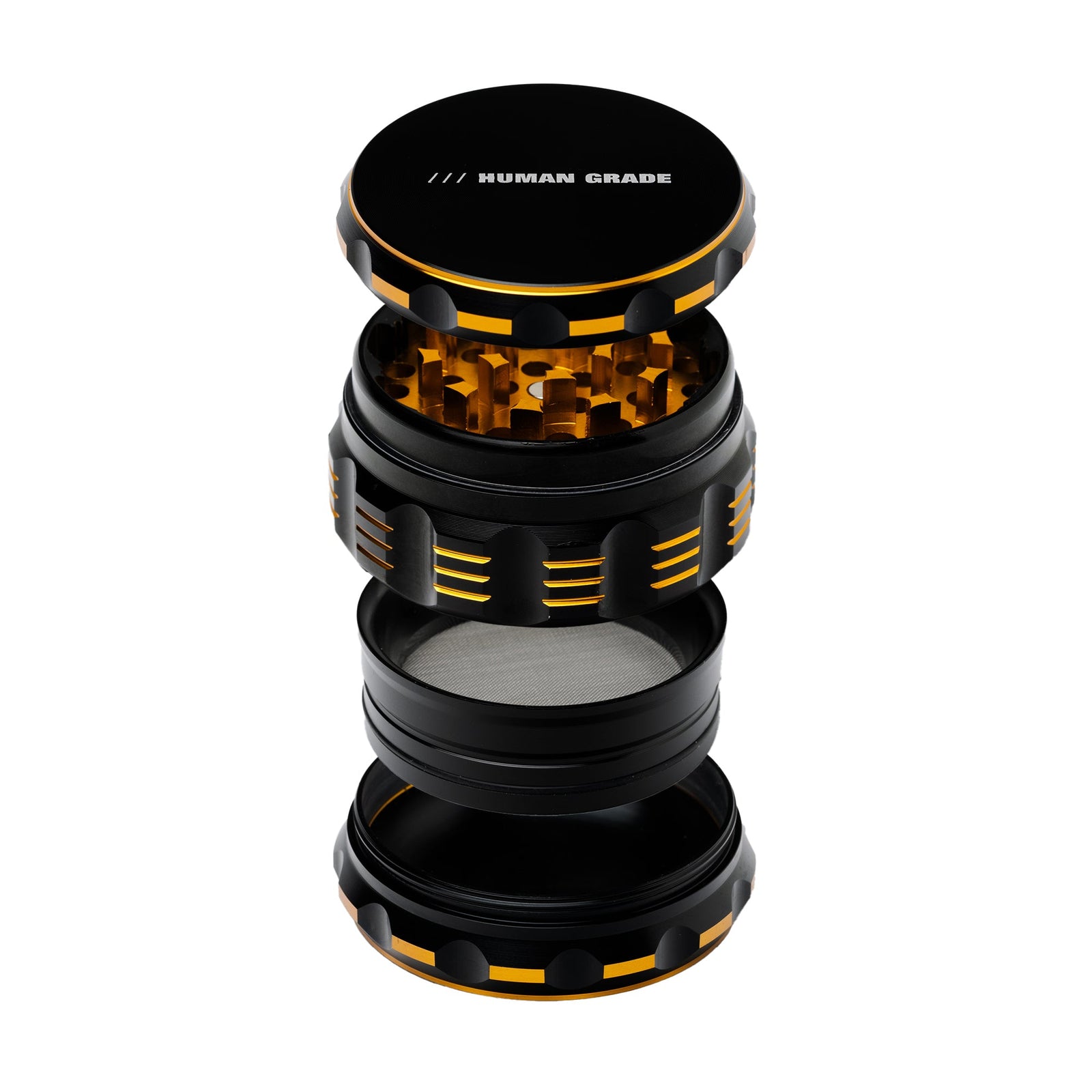 Black and orange herb grinder with 'Human Grade' branding on a white background