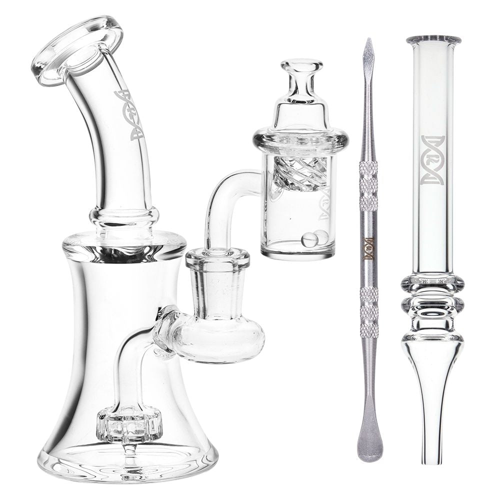 Glass Dab Rig with quartz banger, carb cap, dabbing tool and dab straw bundle on a white background