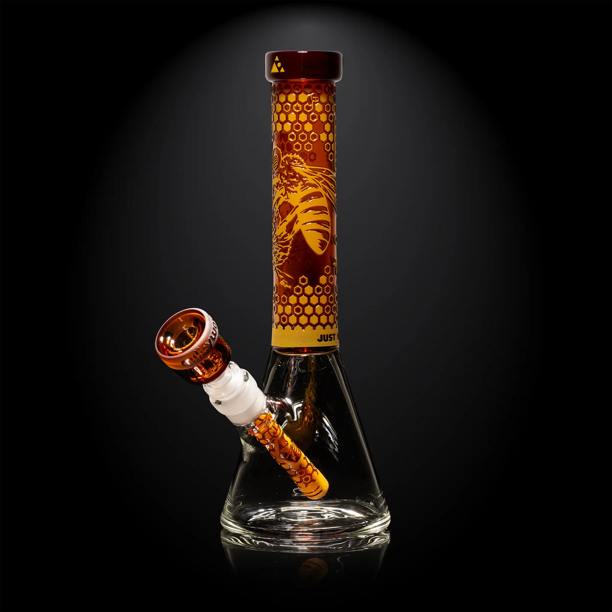 Milkyway Glass bong with hive designs on a black background