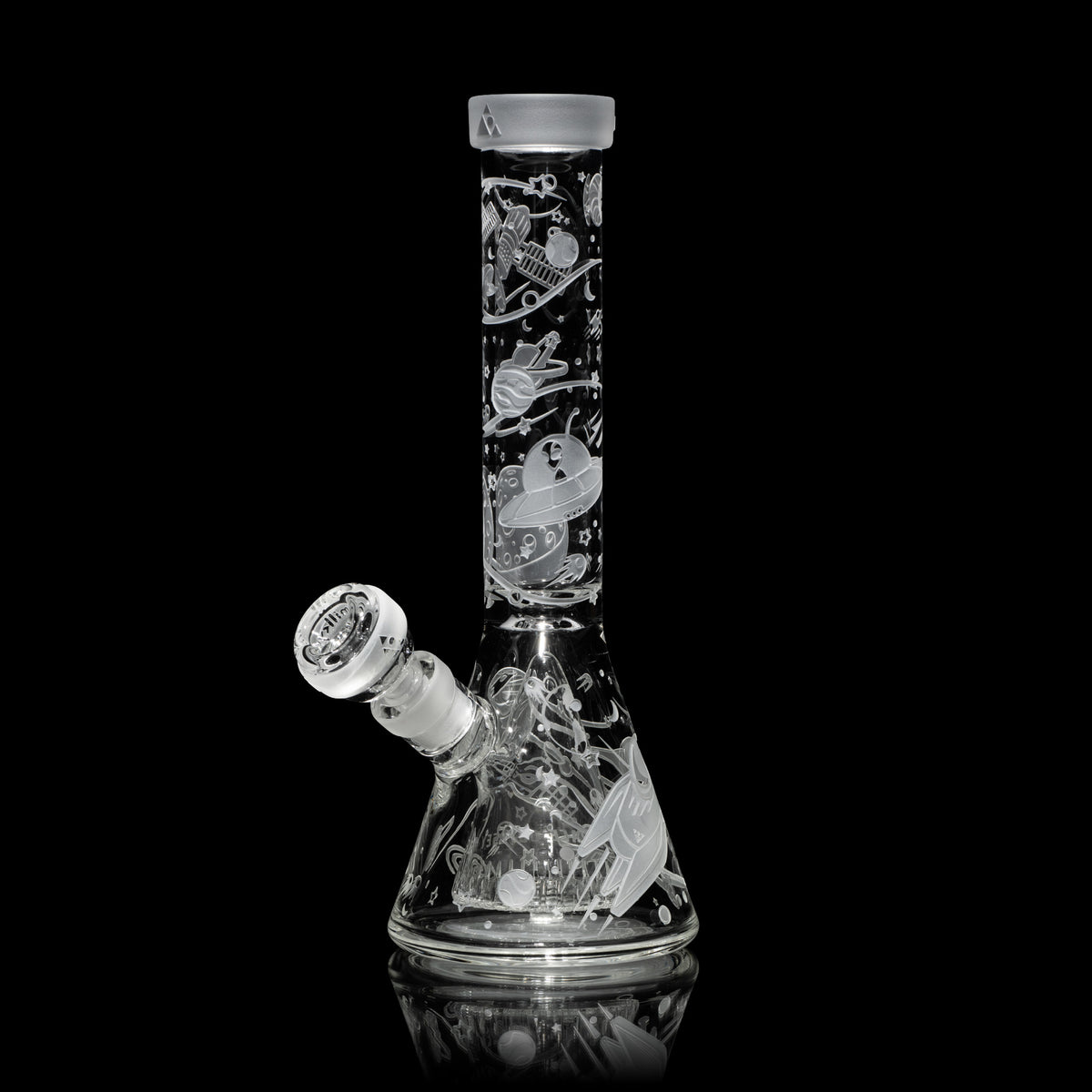 Clear Glass bong with engraved designs on a black background