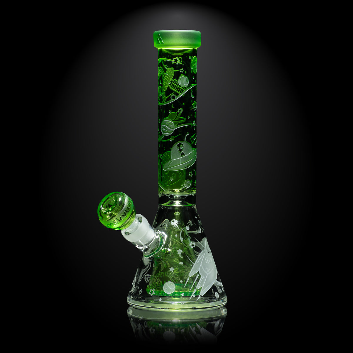 Green glass bong smoking device with leaf patterns on a black background