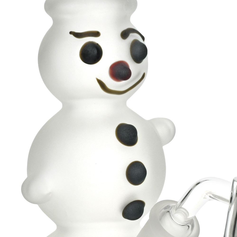 White snowman figurine Glass Rig with black buttons and red mouth on a white background