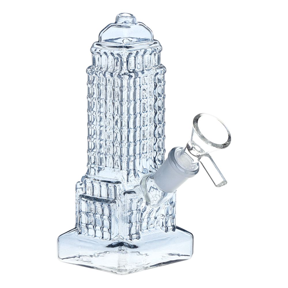 Clear glass water pipe with textured empire state design on a white background