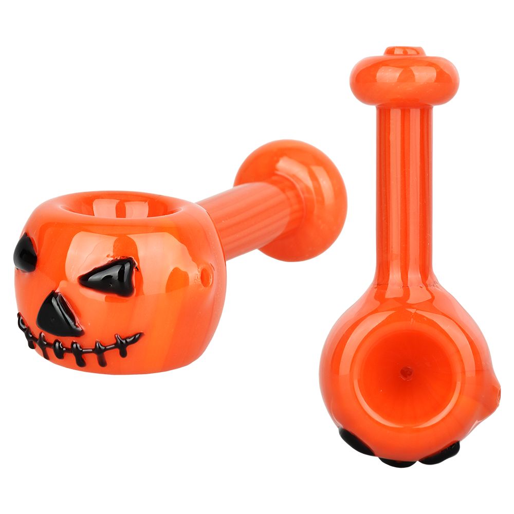Orange pumpkin glass pipe on a white background