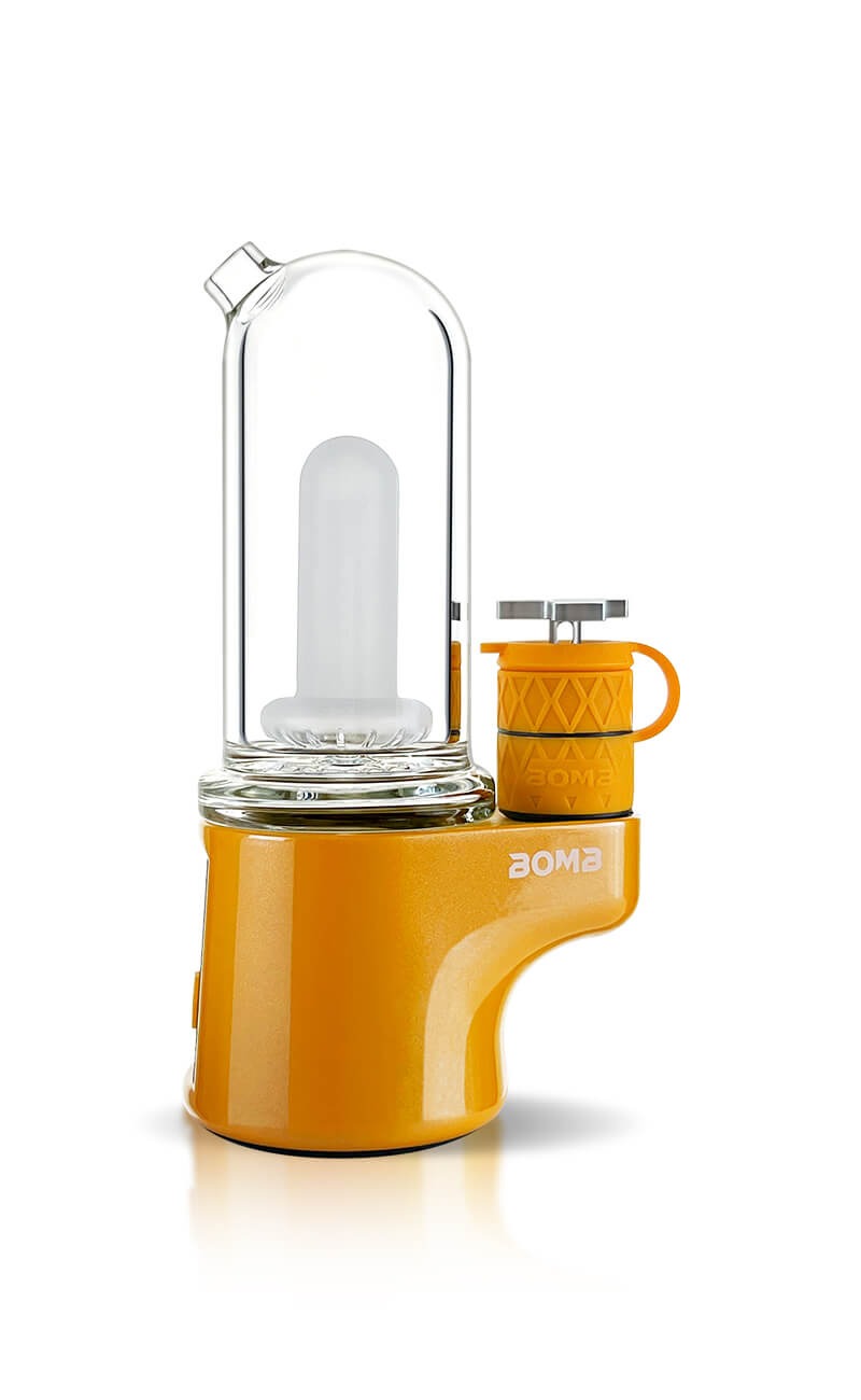 Yellow and clear glass dab Concentrate erig water pipe with a white background