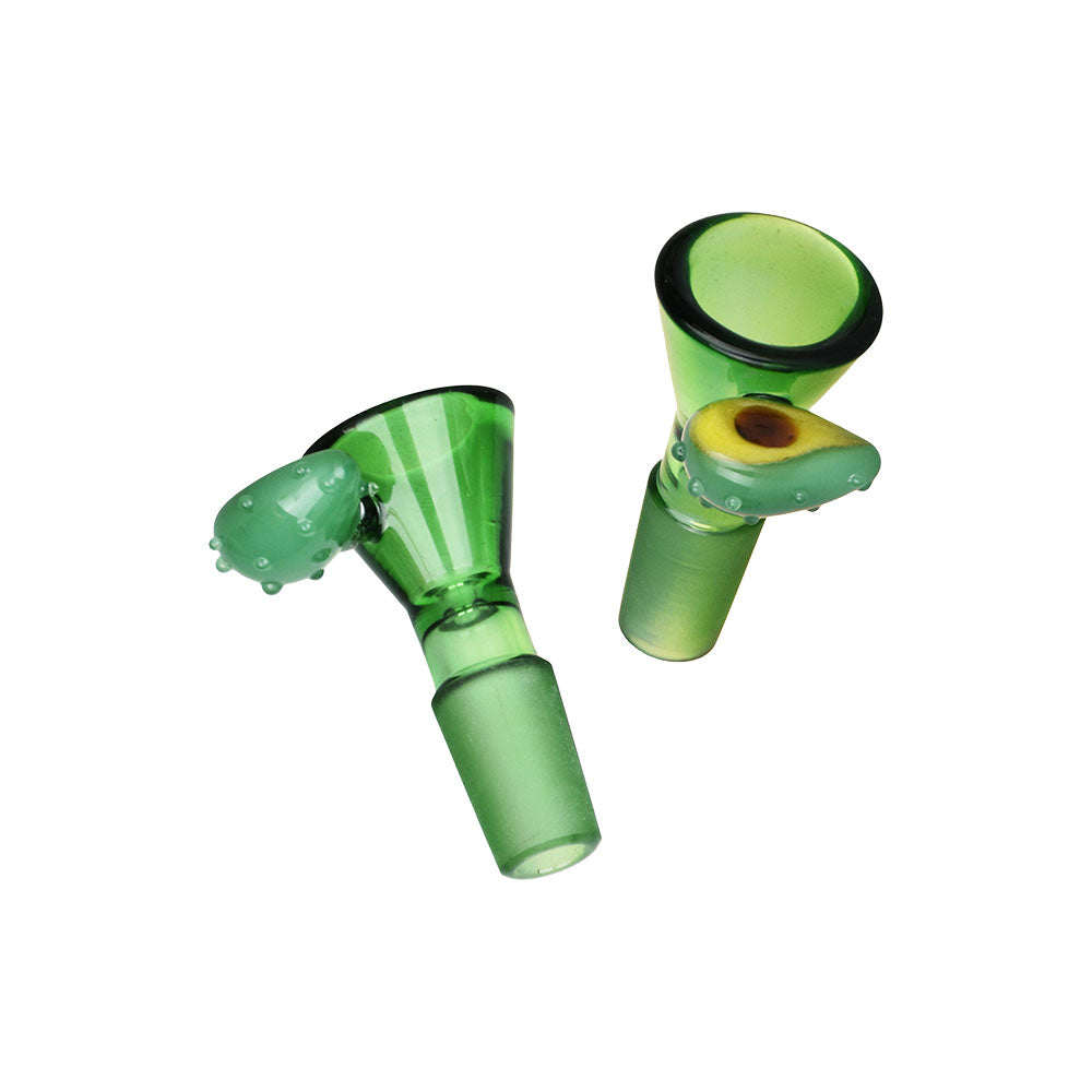 Two green glass smoking accessories on a white background