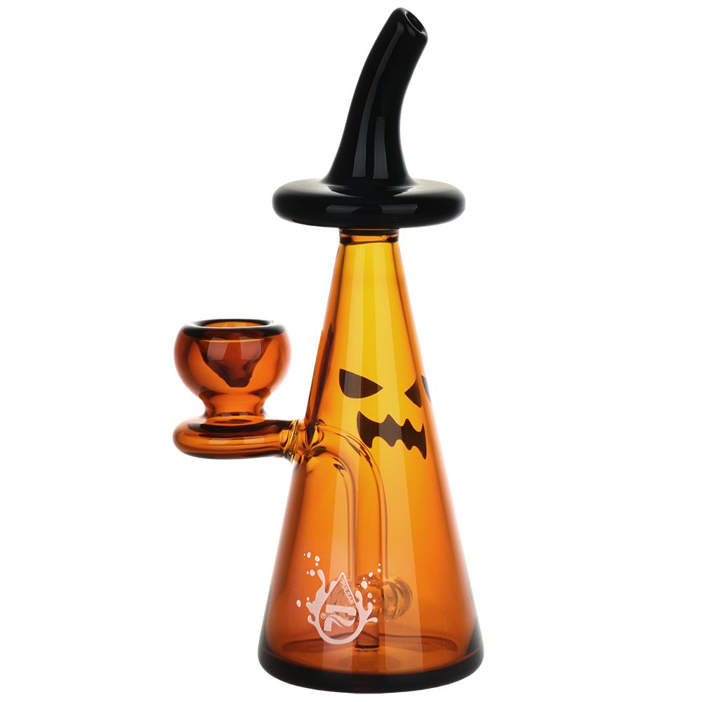 Orange glass smoking accessory with black lid and pumpkin face design on a white background