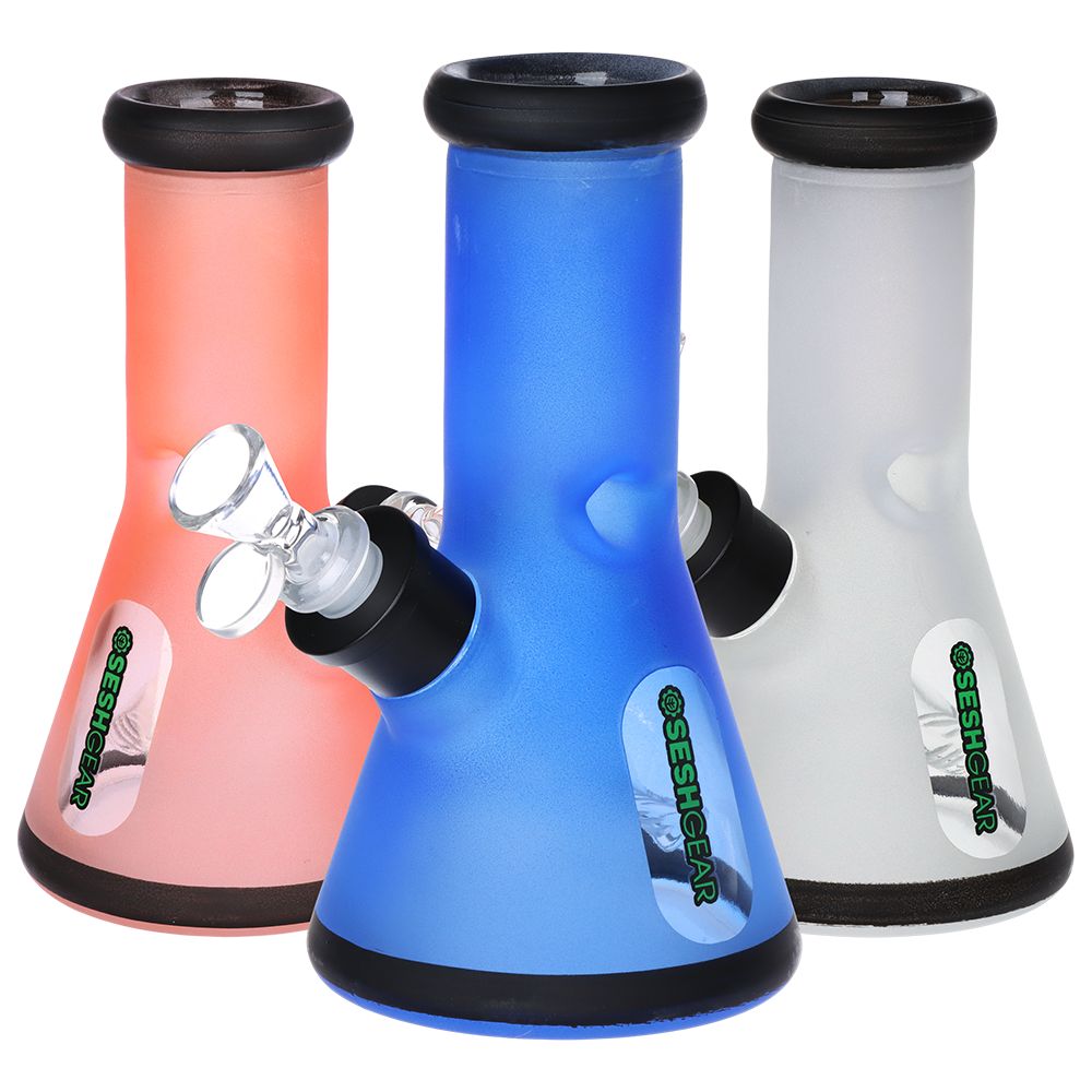 Three colorful bongs in pink, blue, and white with Seshgear' branding on a white background.