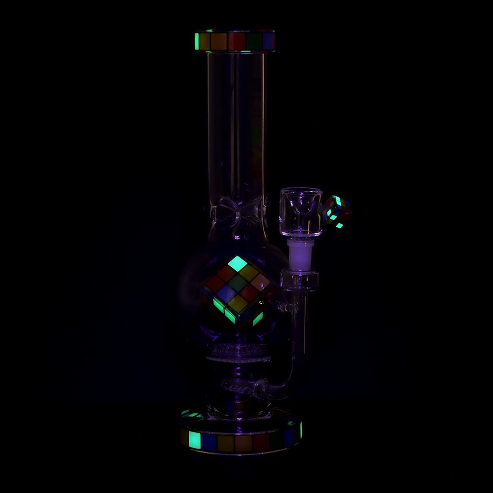 Glass smoking device with colorful geometric patterns on a black background