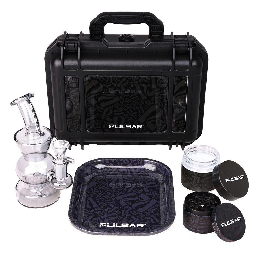 Pulsar cannabis smoking accessory set with black carrying case, glass bong, and other tools on a white background.