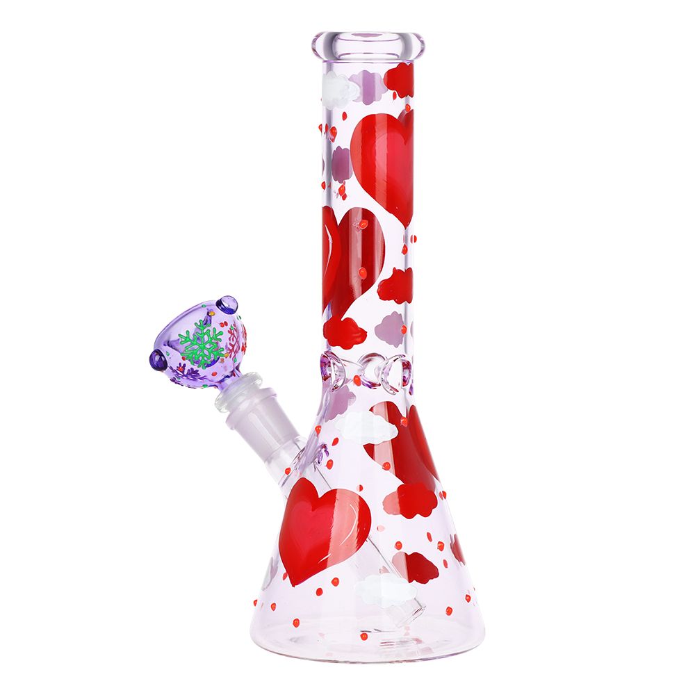Glass water pipe with heart designs on a white background