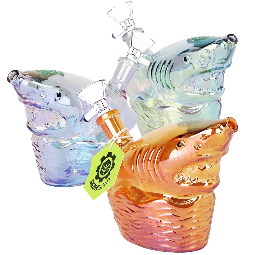 Colorful shark-shaped glass pipes with a visible brand tag on a white background