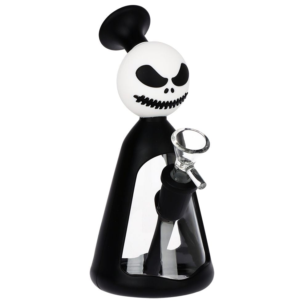A novelty glass water pipe shaped like a stylized character with a white skull head, black hair, and a black body, holding a clear glass bowl. The product is shown on a solid white background.